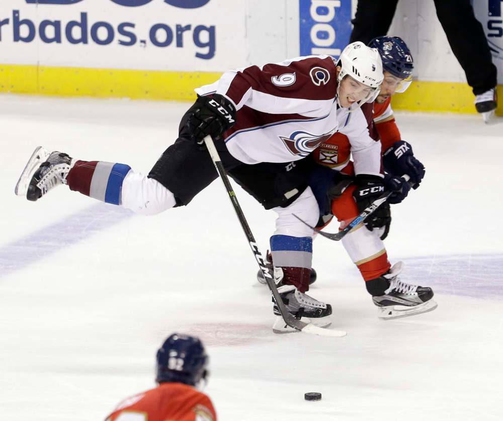 ALAN DIAZ / ASSOCIATED PRESS FILES
Florida Panthers center Vincent Trocheck battles Colorado Avalanche center Matt Duchene, who played his 500th career game, for the puck Saturday.
,