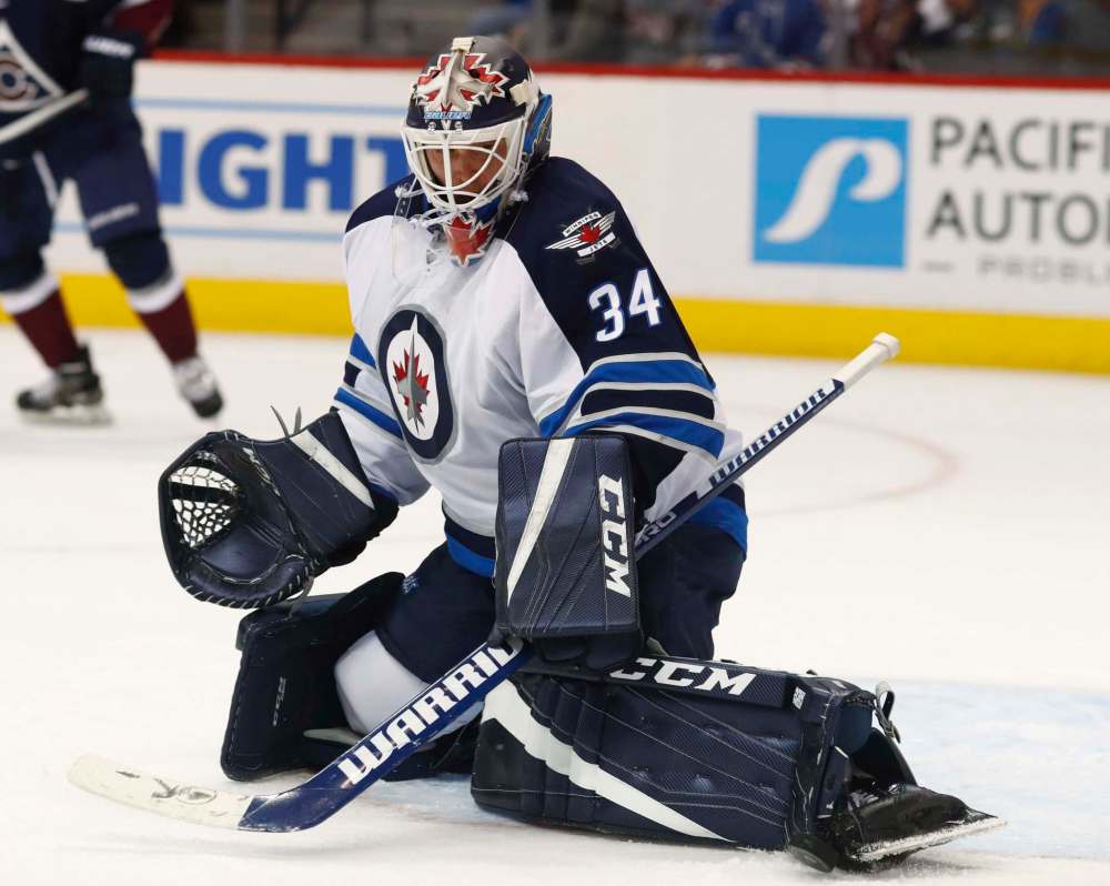 David Zalubowski / The Associated Press
Winnipeg Jets goalie Michael Hutchinson makes a save with his skate on a shot from a Colorado Avalanche player during the third period of an NHL hockey game Friday, Oct. 28, 2016, in Denver. The Jets won 1-0.