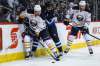 MIKE DEAL / WINNIPEG FREE PRESS
Jets defenceman Dustin Byfuglien is angled out of the play by Sabres defenceman Dmitry Kulikov during Sunday’s game.