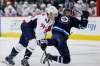 JOHN WOODS / THE CANADIAN PRESS
Washington Capitals' John Carlson (74) checks Winnipeg Jets' Joel Armia (40) during second period NHL action in Winnipeg on Tuesday.