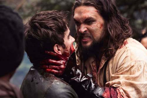 SUPPLIED
A bloody Declan Harp (Jason Momoa, right) threatens Michael Smyth (Landon Liboiron) in Discovery Canada&rsquo;s Frontier.
