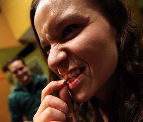 PHIL HOSSACK / WINNIPEG FREE PRESSSarah Ferrari bites into a honey mustard cricket.