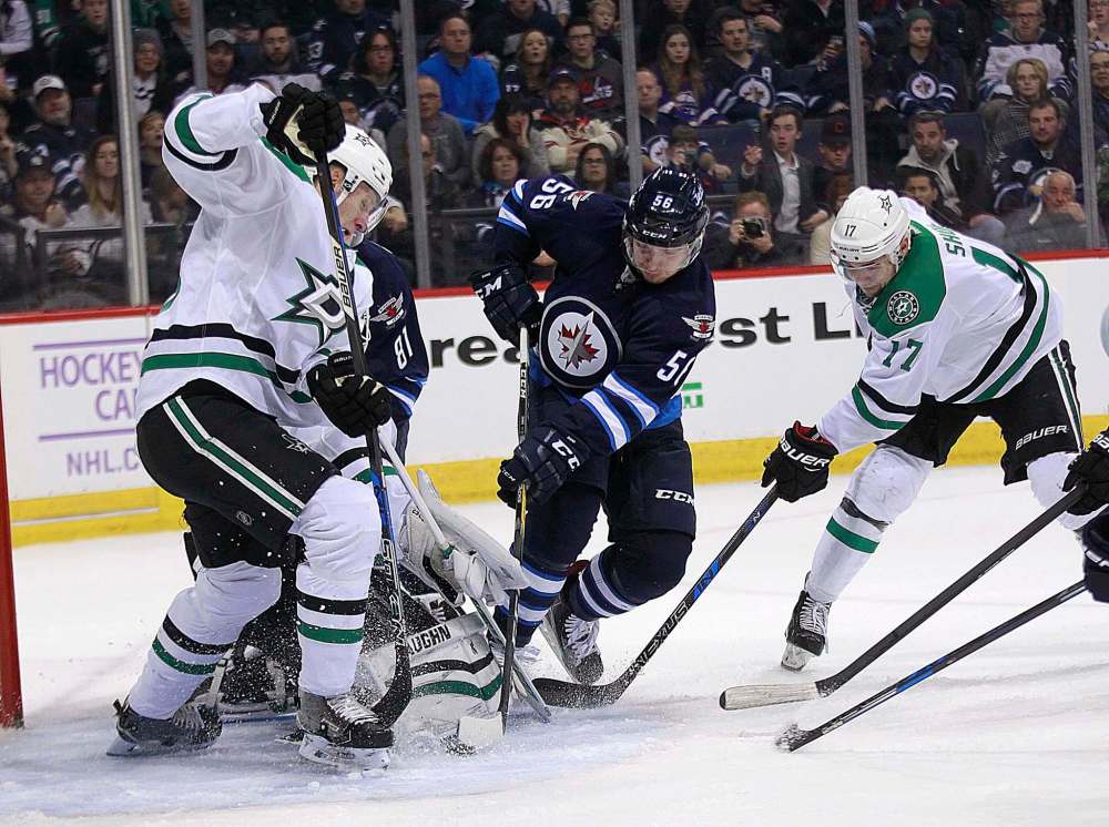 PHIL HOSSACK / WINNIPEG FREE PRESS - Winnipeg Jet #56 Marko Dano slams one through the crowd to score against the Dallas Stars as the two teams meet at the MTS Centre Tuesday. November 8, 2016