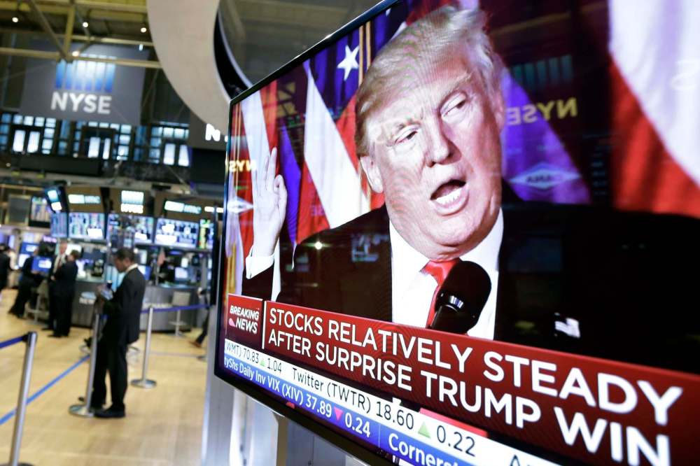 Richard Drew / The Associated Press
An image of President-elect Donald Trump appears on a television screen on the floor of the New York Stock Exchange, Wednesday, Nov. 9, 2016. Stocks are moving solidly higher in midday trading on Wall Street following Donald Trump’s upset victory over Hillary Clinton in the U.S. presidential election.
