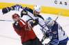 ROSS D FRANKLIN / THE ASSOCIATED PRESS
Arizona Coyotes left wing Jordan Martinook (48) gets checked by Winnipeg Jets defenseman Dustin Byfuglien (33) in front of Jets goalie Connor Hellebuyck during the third period