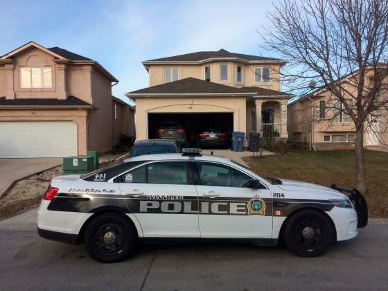 BORIS MINKEVICH / WINNIPEG FREE PRESSPolice outside a house on Kinlock Lane, where two people were sent to hospital Sunday.