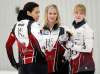 PHIL HOSSACK / WINNIPEG FREE PRESS
Jennifer Jones (centre), Jill Officer (left) and Dawn McEwen wait for a measurement Monday at the Dekalb Superspiel in Morris.