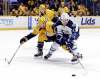 Mark Humphrey / The Associated Press
Winnipeg Jets right-winger Nikolaj Ehlers reaches for the puck as the Nashville Predators’ Matt Irwin pursues Friday.