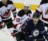 JOE BRYKSA / WINNIPEG FREE PRESS
New Jersey Devils centre Travis Zajac (19) and Jets counterpart Andrew Copp keep an eye on the play Tuesday in Winnipeg.