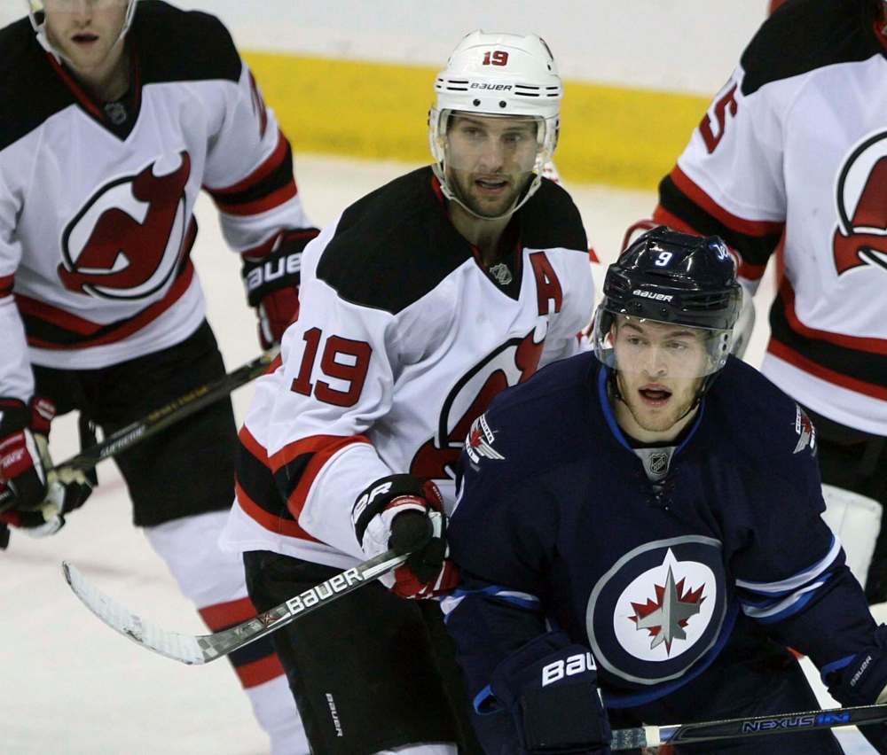 JOE BRYKSA / WINNIPEG FREE PRESS
New Jersey Devils centre Travis Zajac (19) and Jets counterpart Andrew Copp keep an eye on the play Tuesday in Winnipeg.