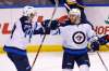 BILLY HURST / THE ASSOCIATED PRESS
Winnipeg Jets' Bryan Little, right, celebrates with Patrik Laine, of Finland, after scoring the game-winning goal in overtime of an NHL hockey game against the St. Louis Blues, Saturday, Dec. 3, 2016, in St. Louis. The Jets won the game 3-2.