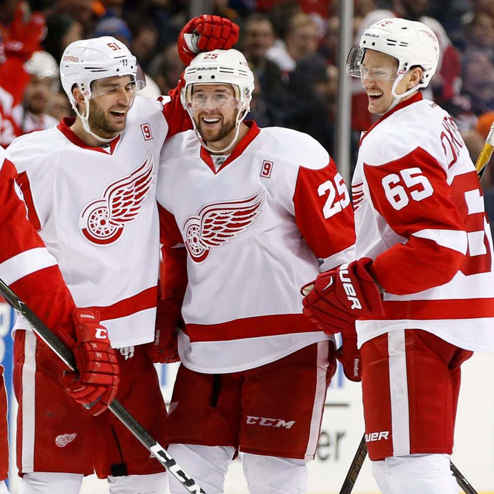 KATHY WILLENS / ASSOCIATED PRESS FILES
Frans Nielsen, left, Mike Green (25) and Danny DeKeyser (65) celebrate after Green had a goal during the third period against the Islanders Sunday. Green's goal was disallowed after a coach's challenge.