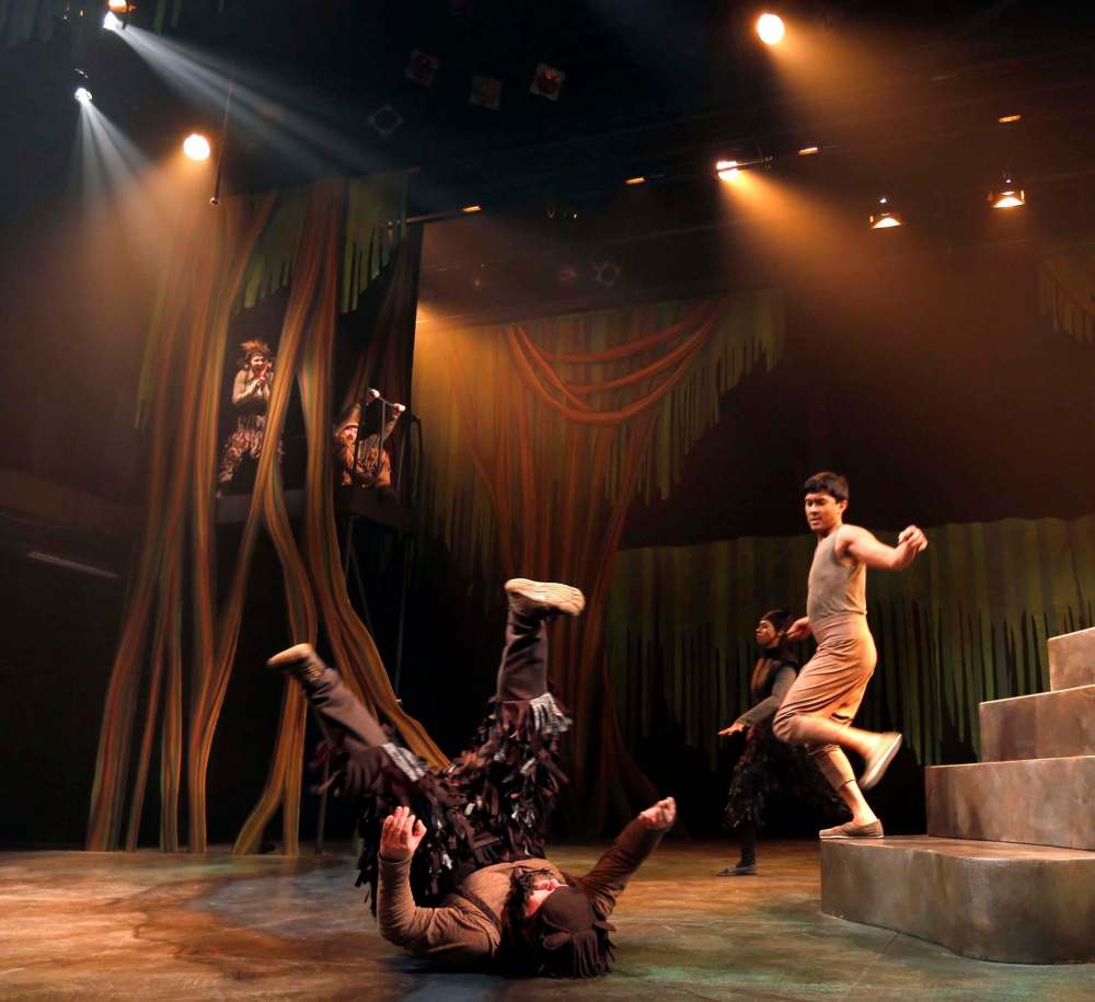 WAYNE GLOWACKI / WINNIPEG FREE PRESS
Mowgli (Adriano Sobretodo Jr.) runs down the steps as Baloo (Cory Wojcik) is on his back in a scene in The Jungle Book at the Manitoba Theatre for Young People.