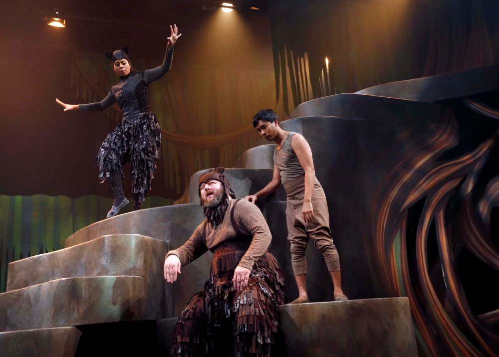 WAYNE GLOWACKI / WINNIPEG FREE PRESS
Mowgli (Adriano Sobretodo Jr.) stands beside Baloo (Cory Wojcik) as Bagheera ( Kimberley Rampersad) creeps down the stairs in a scene in The Jungle Book at the Manitoba Theatre for Young People.