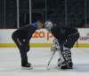 RUTH BONNEVILLE / WINNIPEG FREE PRESS
Winnipeg Jets goaltending coach Wade Flaherty works with netminder Connor Hellebuyck after team practice Wednesday at the MTS Centre.