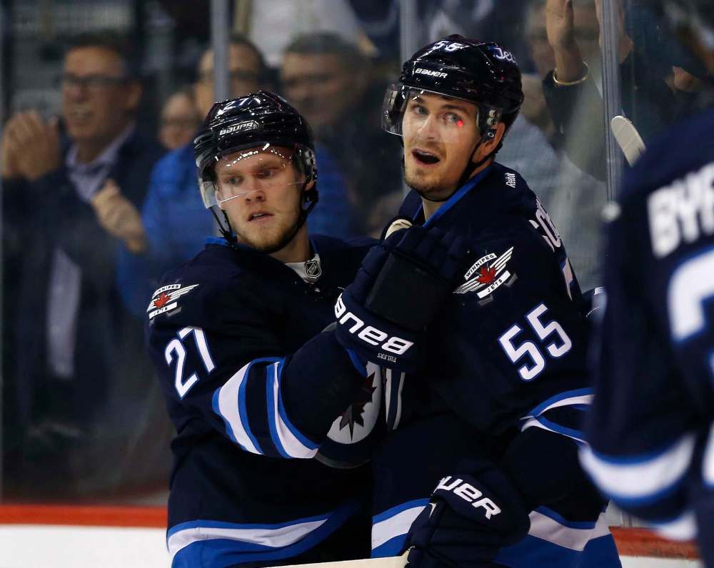 THE CANADIAN PRESS/JOHNS WOODS
Nikolaj Ehlers and Winnipeg Jets' Mark Scheifele, celebrate Scheifele's goal against the New Jersey Devils Tuesday. Ehlers scoring drought has hit 15 games.