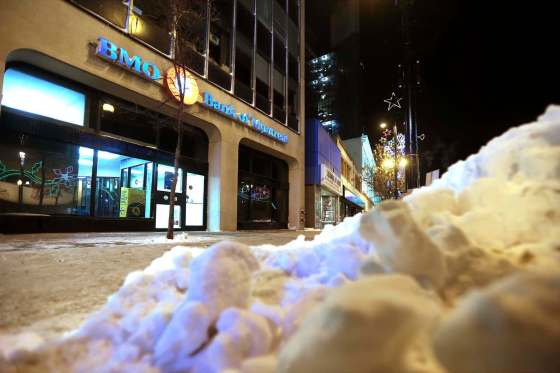 JOHN WOODS / WINNIPEG FREE PRESSParamedics were called this weekend to the 300 block of Portage Avenue for a person down on the street. The woman died but they were able to save a different man by pulling him into a bank ATM lobby.