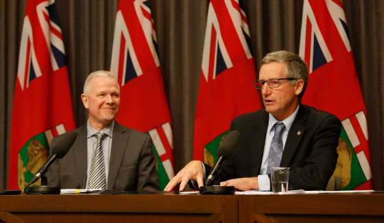 WAYNE GLOWACKI / WINNIPEG FREE PRESSBlaine Pedersen, right, minister of infrastructure, and Doug McMahon, assistant deputy minister with Infrastructure, detail the latest flood report Tuesday.