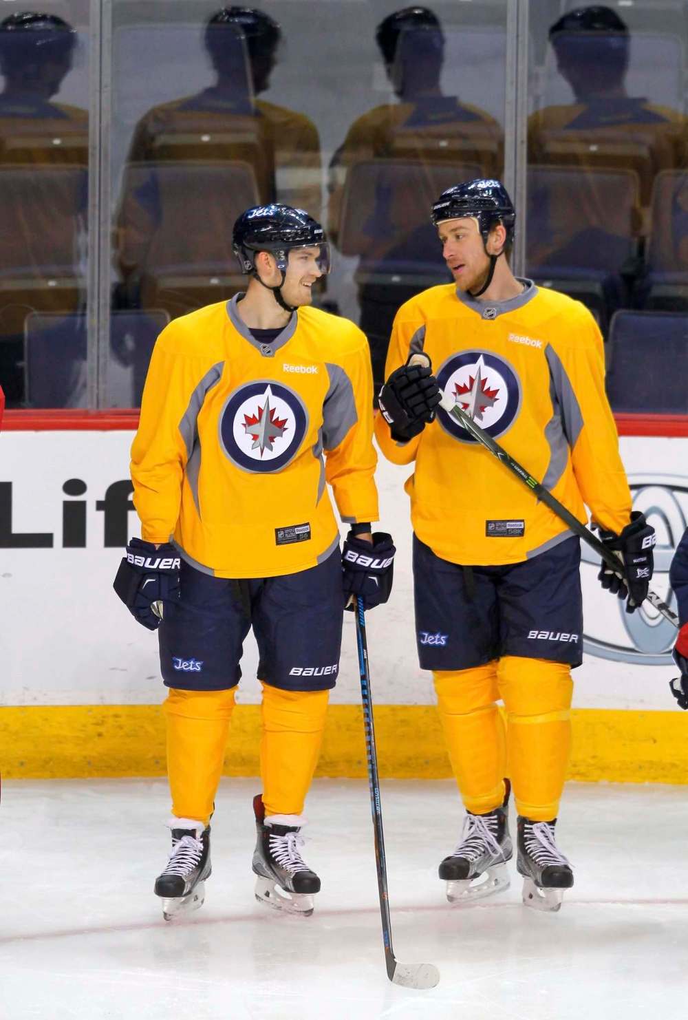 BORIS MINKEVICH / WINNIPEG FREE PRESS
Joel Armia (left) and Shawn Matthias wear yellow non-contact jerseys during practice.