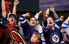 Ross D. Franklin / The Associated Press
Winnipeg Jets fans celebrate a goal against the Arizona Coyotes during the first period of an NHL hockey game Thursday, Oct. 9, 2014, in Glendale, Ariz.