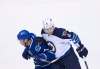 Darryl Dyck / The Canadian Press files
Jacob Trouba, seen checking Vancouver Canucks forward Sven Baertschi in a recent game, is much stronger than he was last season, Winnipeg Jets head coach Paul Maurice says.