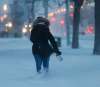 WAYNE GLOWACKI / WINNIPEG FREE PRESS
A pedestrian on Portage Ave. Monday morning faces the Boxing Day winter storm.