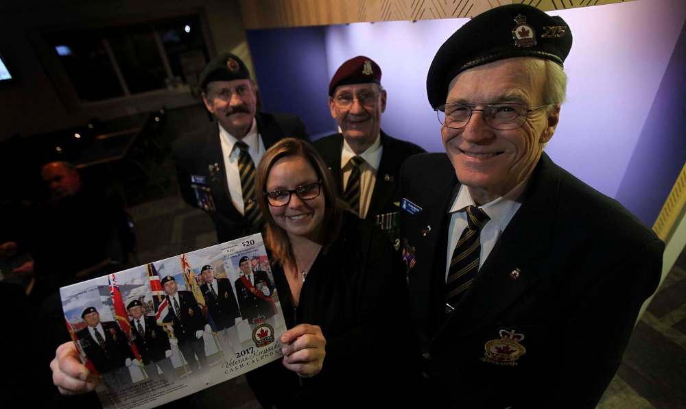 PHIL HOSSACK / WINNIPEG FREE PRESS
Claude Gagnon (from left), Nicole Fanshaw, Al Mills and Gordon Machej with the fundraising calendar for the Royal Canadian Legion, Branch 215.