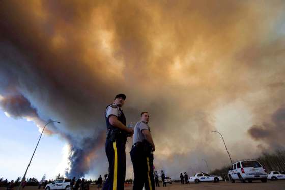 Jason Franson / The Canadian Press filesThe ferocious wildfire forced about 90,000 to flee Fort McMurray, Alta., in May and reduced thousands of homes to cinders. It has been picked as the top news story of 2016 by Winnipeg Free Press readers.