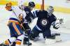 JOHN WOODS / THE CANADIAN PRESS
Winnipeg Jets goaltender Connor Hellebuyck (37) saves the shot from New York Islanders' Casey Cizikas (53) as Jets' Paul Postma (4) defends during first period NHL action.