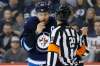 JOHN WOODS / THE CANADIAN PRESS
Winnipeg Jets' Blake Wheeler (26) shows the referee the results of a high stick by a New York Islanders player during the second period.