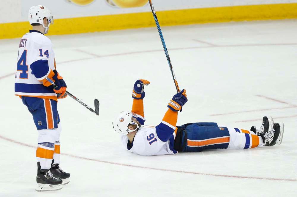 JOHN WOODS / THE CANADIAN PRESS
New York Islanders' Andrew Ladd (16) celebrates his goal against the Winnipeg Jets as Thomas Hickey (14) looks on during the third period.