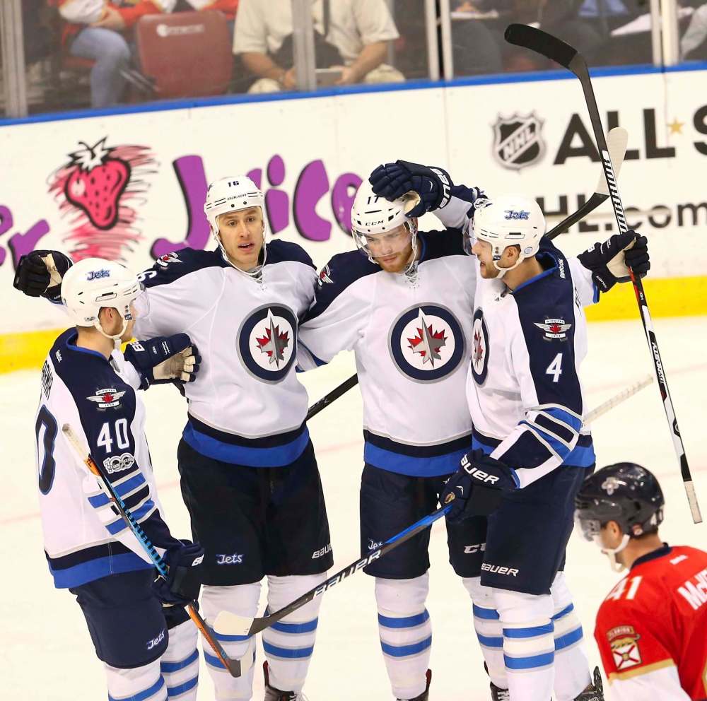 DAVID SANTIAGO / EL NUEVO HERALD
The Winnipeg Jets' Shawn Matthias celebrates with teammates after scoring during the second period against the Florida Panthers at BB&T Center in Sunrise, Fla., on Wednesday.