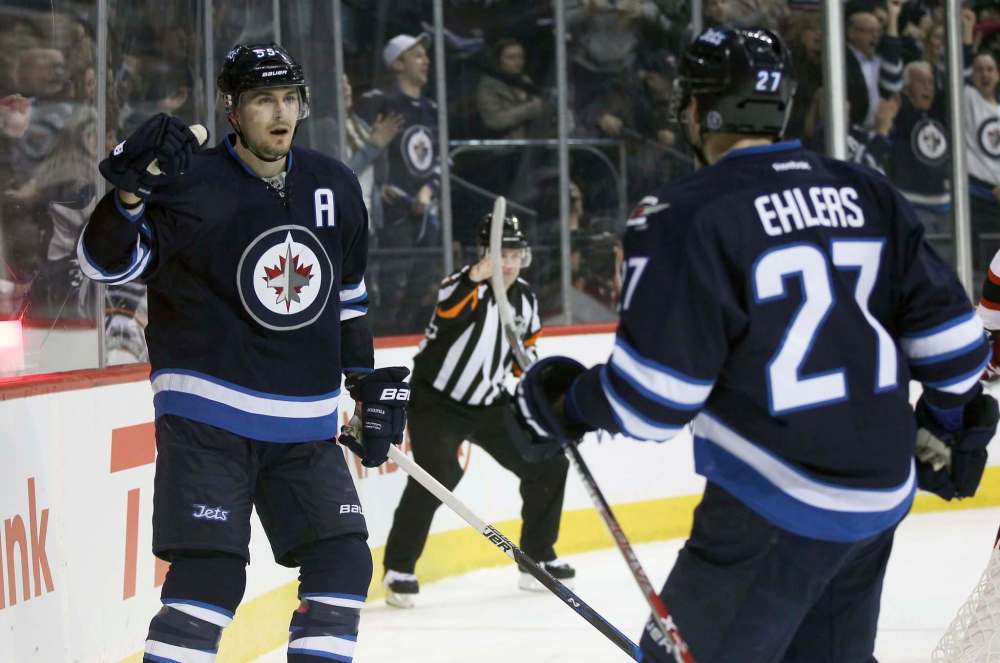 JOE BRYKSA / WINNIPEG FREE PRESS
Winnipeg Jets Mark Scheifele, left, says he won't change the way he leads rushes, even though linemate Patrik Laine took a concussion Saturday when he was hit after accepting a Schiefele pass.