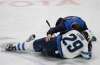 JEFFREY T. BARNES / THE ASSOCIATED PRESS FILES
Winnipeg forward Patrik Laine is helped by a trainer after getting hit by Buffalo's Jake McCabe during a game on Saturday in Buffalo.