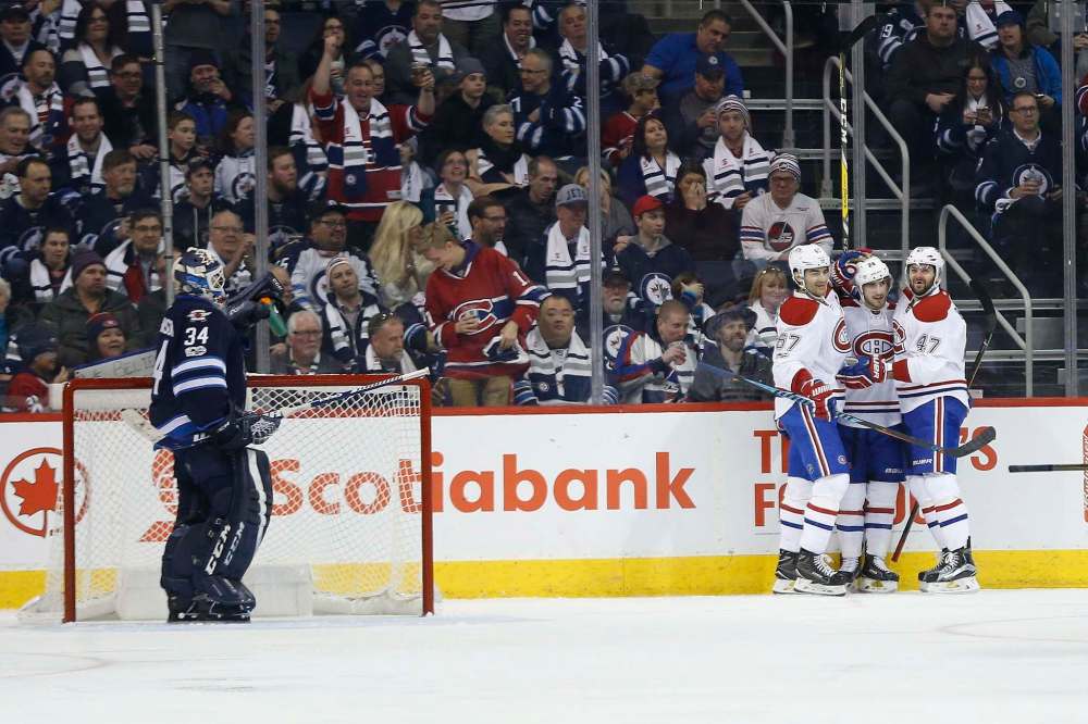 JOHN WOODS / THE CANADIAN PRESS
Montreal Canadiens' Max Pacioretty, Phillip Danault and Alexander Radulov celebrate after Danault scored on Winnipeg Jets goaltender Michael Hutchinson during second period NHL action in Winnipeg on Wednesday.