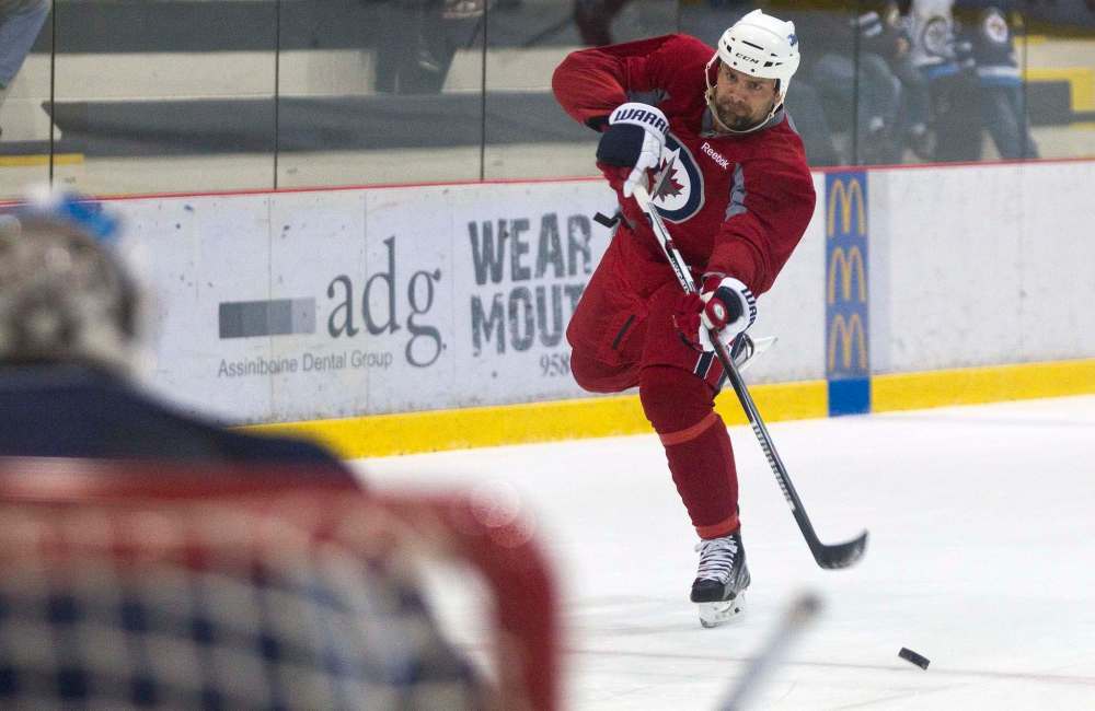 MIKE DEAL / WINNIPEG FREE PRESS
Winnipeg Jets' Mark Stuart (5) is included in the lineup for the first time since Nov. 29.