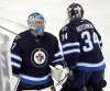 PHIL HOSSACK / WINNIPEG FREE PRESS FILES
Connor Hellebuyck, left, and Michael Hutchinson have not been the answer in goal that the Jets were looking for this season.