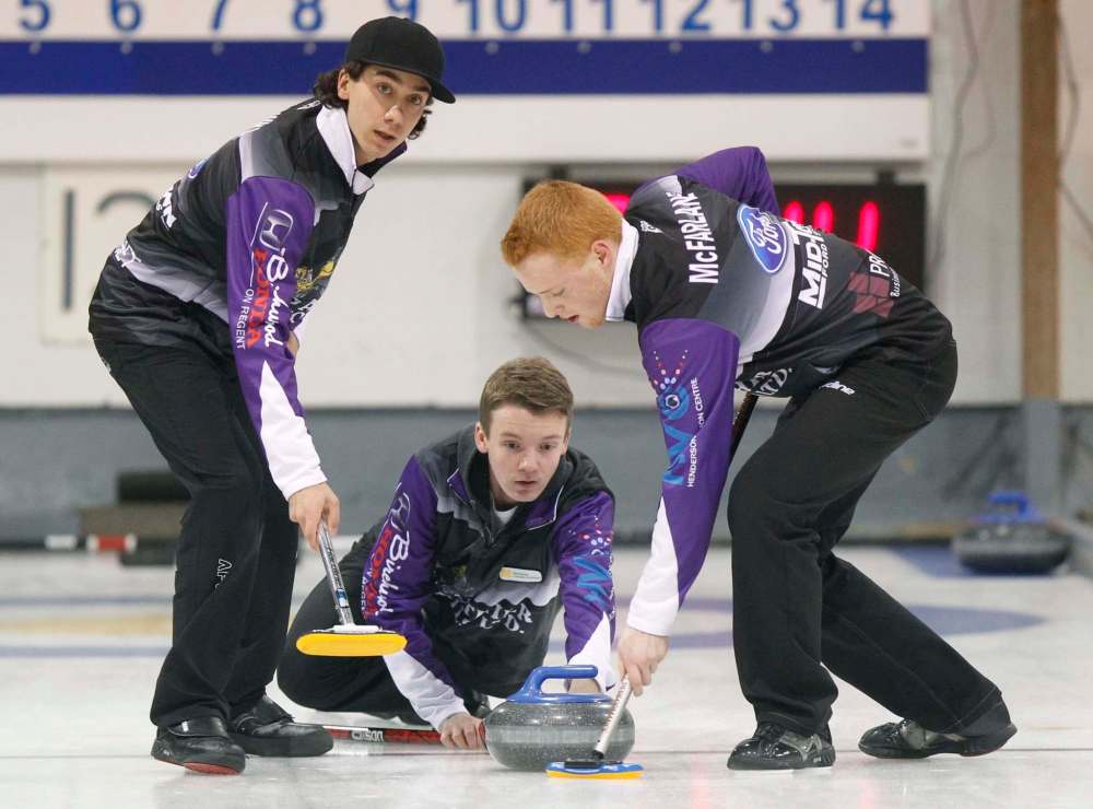 PHIL HOSSACK / FREE PRESS FILES
J.T. Ryan, framed by rinkmates Brendan Bilawka (left) and Graham McFarlane, represents Manitoba at the national junior men’s curling event this weekend in Victoria.