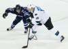 JOHN WOODS / WINNIPEG FREE PRESS
In his first game back after returning from injury, Winnipeg Jets' Patrik Laine attempts to check San Jose Sharks' Patrick Marleau during first period in Winnipeg Tuesday.