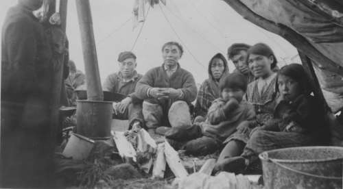 Eddy's grandfather Weetaltuk in a family circle at the beginning of the 19302. He was renowned in the region because of his many talents. George Weetaltuk also produced drawings and carvings and was one of the first recognized Inuit artists.