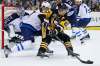 AP Photo/Gene J. Puskar
Pittsburgh Penguins' Sidney Crosby looks to pass with Winnipeg Jets' Adam Lowry defending in front of goalie Connor Hellebuyck during the second period of an NHL hockey game in Pittsburgh, Thursday, Feb. 16, 2017.