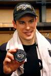 Gene J. Puskar / The Associated Press
Pittsburgh Penguins&rsquo; Sidney Crosby holds the puck honoring the 1,000th point in his NHL career, in the locker room after scoring in overtime of the team&rsquo;s NHL game against the Winnipeg Jets in Pittsburgh, Thursday, Feb. 16, 2017. Crosby had an assist on a goal by Penguins&rsquo; Chris Kunitz in the first period to reach 1,000 points.