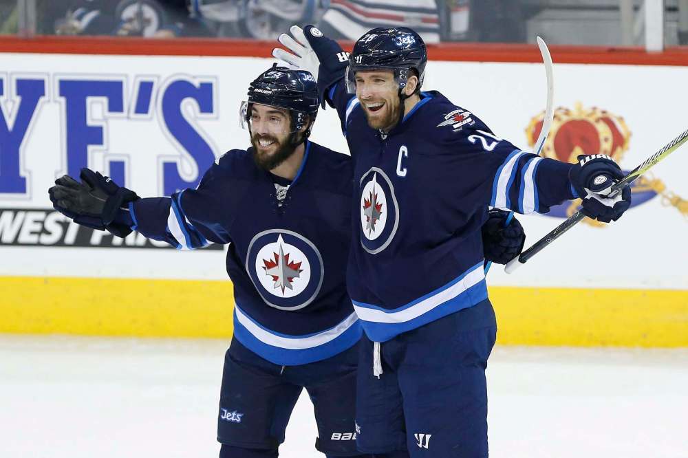 John Woods / The Canadian Press
Winnipeg Jets' Blake Wheeler (right) and Mathieu Perreault celebrate Wheeler's power-play goal against St. Louis Friday.