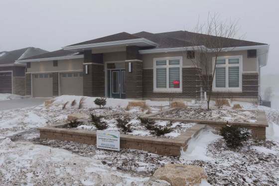 JOHN WOODS / WINNIPEG FREE PRESSThis home at 141 Rose Lake Court is a former show home that sold for $1.4M. Seven homes sold for at least $1M in February. Home buyers will have to pay thousands more once city growth fees take effect in May.