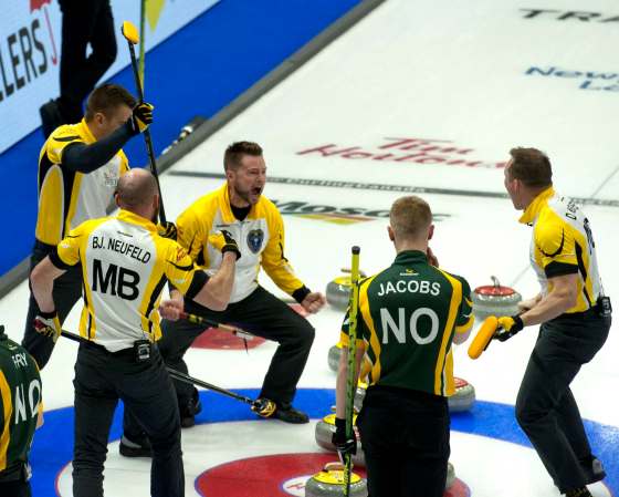 CURLING CANADA / MICHAEL BURNS PHOTOTeam Manitoba skip Mike McEwen, third B.J.Neufeld, second Matt Wazonaik, and lead Denni Neufeld celebrate after winning 6-5 over Northern Ontario Wednesday.
