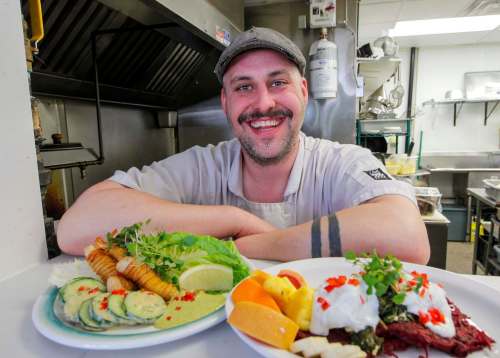 BORIS MINKEVICH / WINNIPEG FREE PRESS
Chef Leighton Fontaine of the Village Diner presents some of his most popular dishes: pickerel fingers (left) and potato and beet latkes.