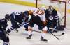 Trevor Hagan / The Canadian Press
Winnipeg's Patrik Laine (left) breaks up a play by Philadelphia forward Wayne Simmonds in front of Jets goalie Michael Hutchinson during first-period action Tuesday in Winnipeg.