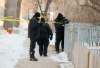BORIS MINKEVICH / WINNIPEG FREE PRESS
Police and Forensic Unit members at the shooting scene on the 200 block of Spence Street in March.