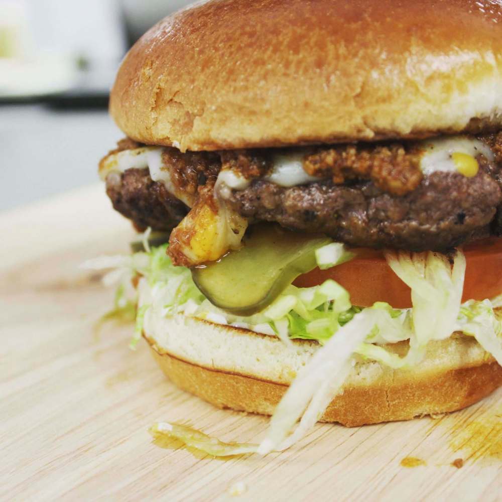 SUPPLIED
Downtown BIZ CEO Stefano Grande says the chef of Tipsy Cow thinks outside the box with his burgers.