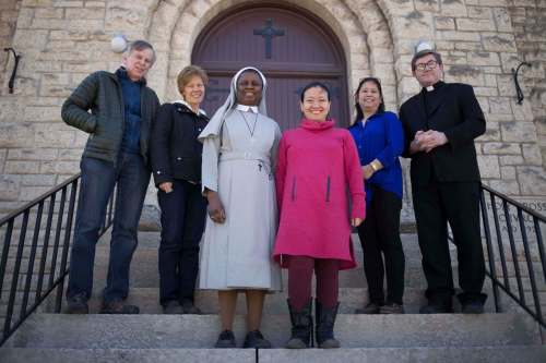 John Scatliff (from left), Carla Gervais, Sister Bibiana Ikwun, Anita Bondoc, Judith Vasquez and Father Peter Karsuski are helping organize the procession for the 100th anniversary of Fatima on May 3. (Jen Doerksen / Winnipeg Free Press)
